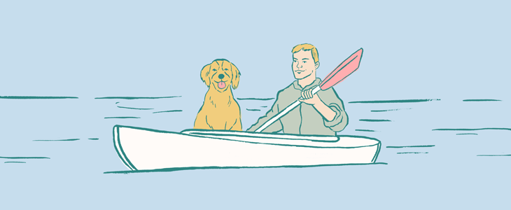 man with dog in a kayak